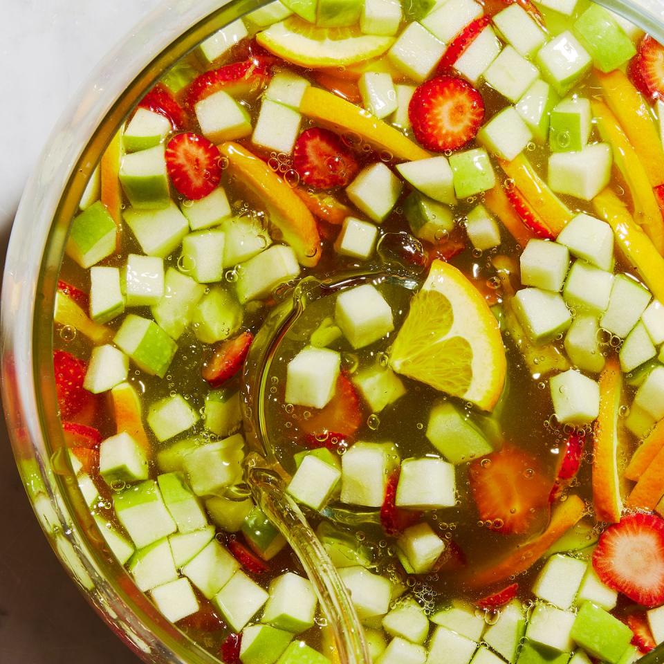 green apple moscato sangria with strawberries, oranges, and green apples