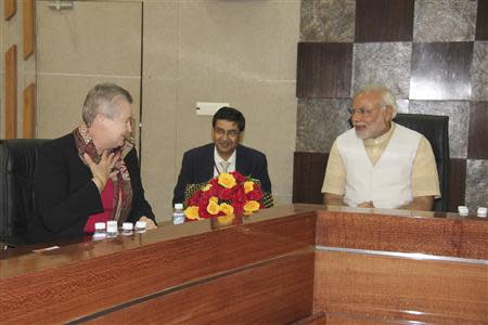 U.S. ambassador to India Nancy Powell (L) and Hindu nationalist Narendra Modi (R), prime ministerial candidate for India's main opposition Bharatiya Janata Party (BJP) and Gujarat's chief minister, speak during their meeting in Gandhinagar in the western Indian state of Gujarat February 13, 2014.REUTERS/Gujarat Information Department/Handout via Reuters