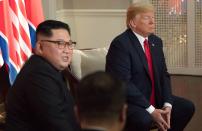 <p>North Korea’s leader Kim Jong Un (L) sits down with US President Donald Trump (R) their historic US-North Korea summit, at the Capella Hotel on Sentosa island in Singapore on June 12, 2018. (Photo: Saul Loeb/AFP/Getty Images) </p>