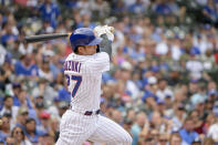 Chicago Cubs' Seiya Suzuki singles against the Miami Marlins during the first inning of a baseball game, Sunday, Aug. 7, 2022, at Wrigley Field in Chicago. (AP Photo/Mark Black)