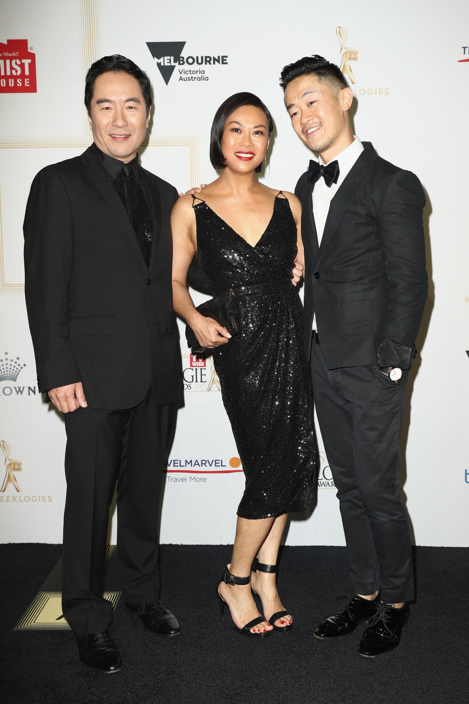 Benjamin Law (R) with Anthony Brandon Wong (L) and Fiona Choi (C) who play Danny and Jenny Law on The Family Law. Photo: Getty