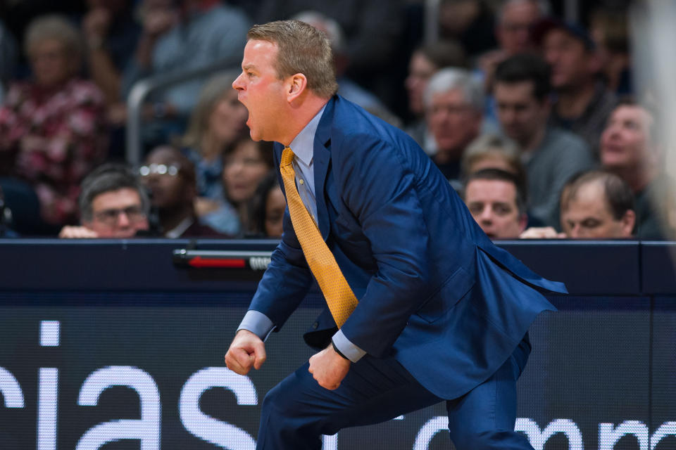 Marquette Golden Eagles head coach Steve Wojciechowski celebrates on the sideline.