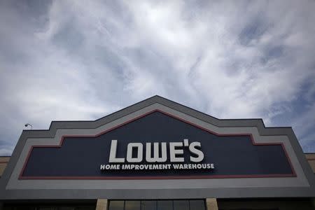 Lowe's rises despite warning on guidance.