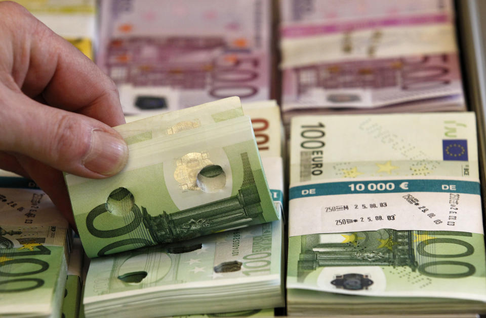 Punctured euro banknotes which are used to train sniffer dogs, are presented to the media during a news conference on German custom's annual statistics, in Berlin March 21, 2014. REUTERS/Tobias Schwarz (GERMANY - Tags: POLITICS BUSINESS)