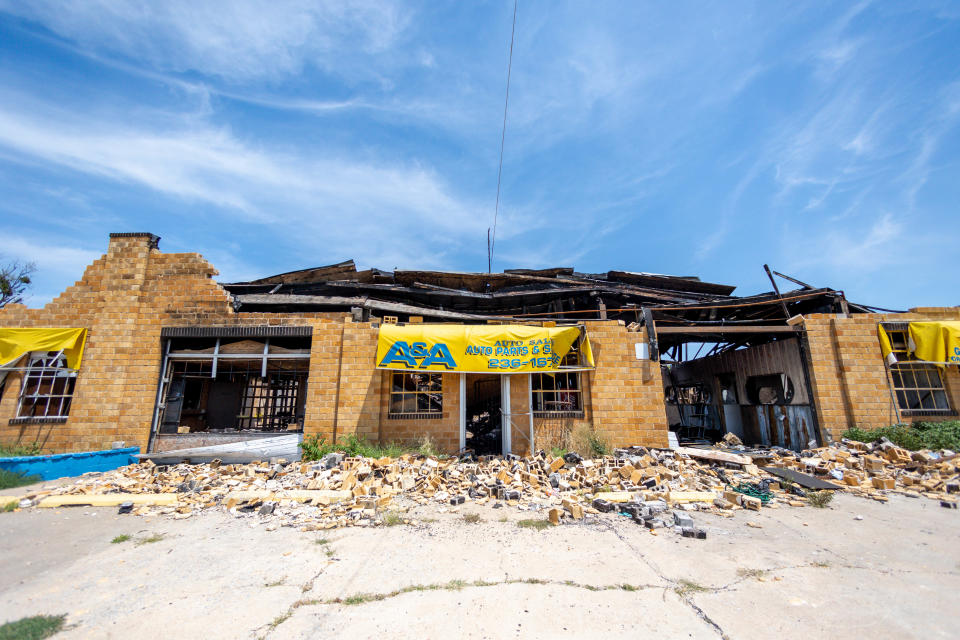 The burned-out former A&A Auto Parts & Salvage sits empty July 25 in Oklahoma City across from Scissortail Park.