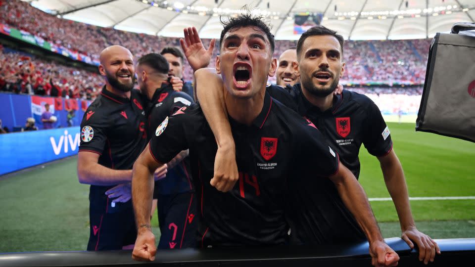 Albania players celebrate scoring the first goal of the game. - Dan Mullan/Getty Images