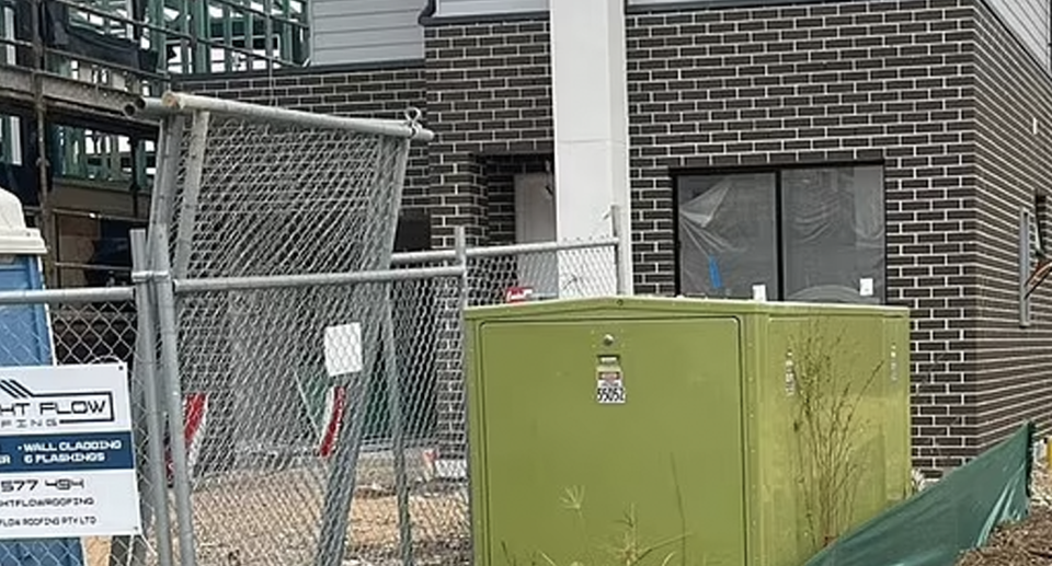 A large transformer box right outside of a Sydney property. 