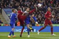 Liverpool's Ibrahima Konate, center left, and Leicester City's Jonny Evans battle for the ball during the English Premier League soccer match at the King Power Stadium, Leicester, England, Monday May 15, 2023. (Tim Goode/PA via AP)