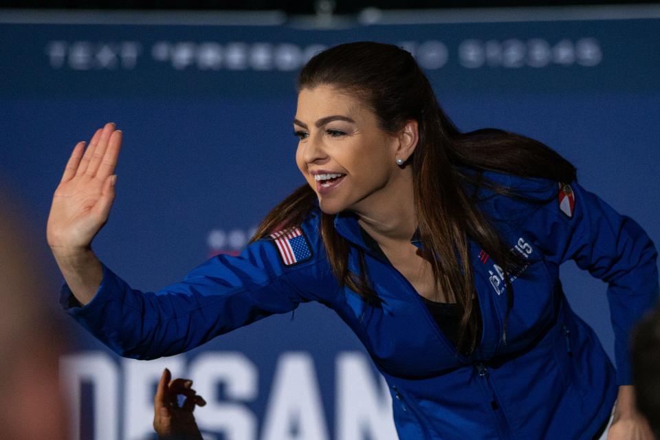 Casey DeSantis high-fives supporters of GOP candidate Ron DeSantis during his Iowa Caucus party at the Sheraton West Des Moines on Monday, Jan. 15, 2024.