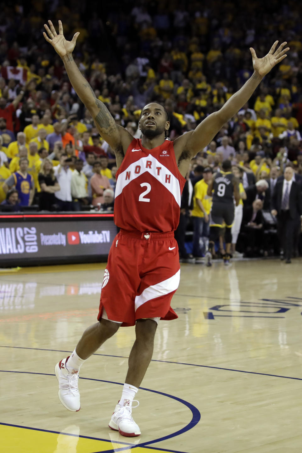 Toronto Raptors forward Kawhi Leonard celebrates after the Raptors defeat the Golden State Warriors 114-110 in Game 6 of basketball's NBA Finals in Oakland, Calif., Thursday, June 13, 2019. (AP Photo/Ben Margot)