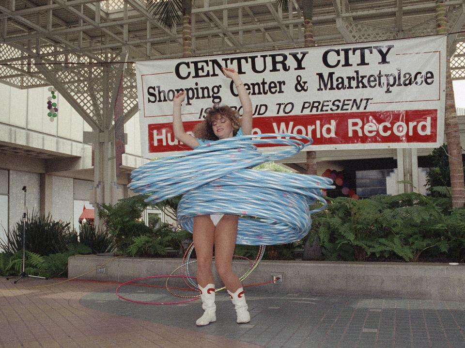 Dessi Kehaiova, a hula hoop artist breaks the Guinness Book of World Records female hula hoop record by rotating 75 hoops in 1991.