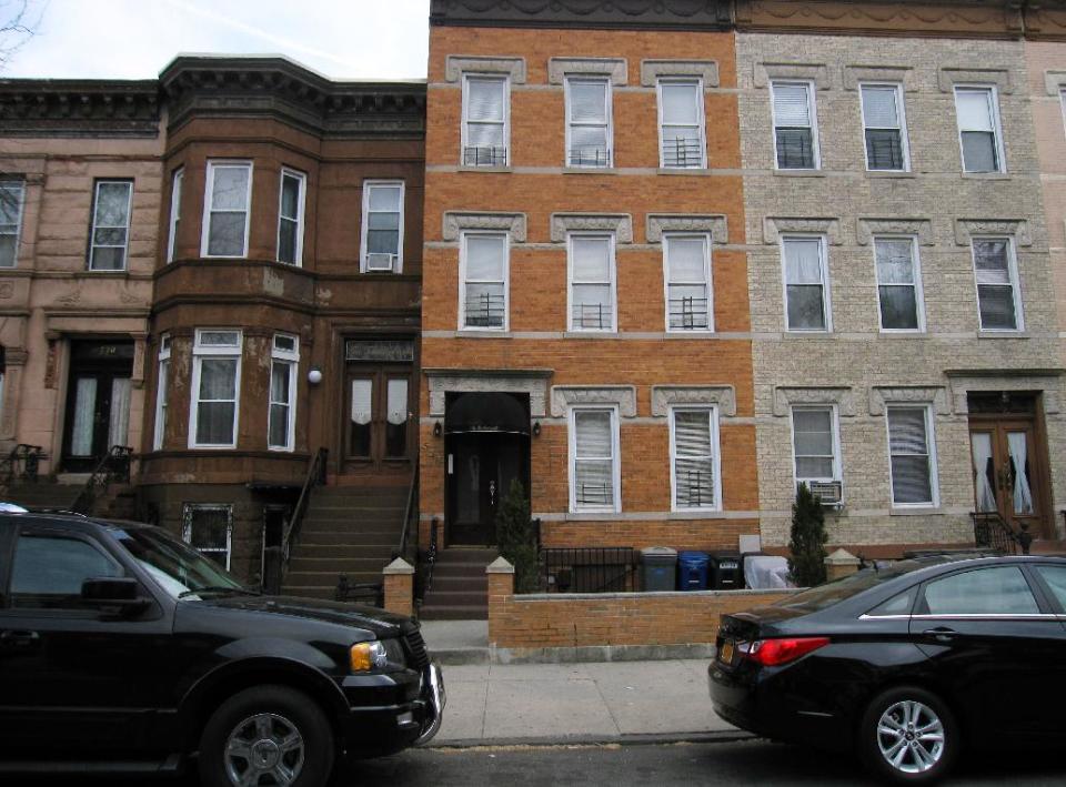 This April 7, 2013 image shows a building on MacDonough Street in the Bedford-Stuyvesant section of Brooklyn where Jackie Robinson and his wife Rachel lived during his 1947 rookie season with the Brooklyn Dodgers. A new movie, “42,” tells Robinson’s inspiring story as the man who integrated Major League Baseball. Although much of the movie was filmed in the South, some scenes were shot on MacDonough because the filmmakers could not find a building elsewhere with the distinctive front stoop commonly found in Brooklyn. (AP Photo/Beth J. Harpaz)