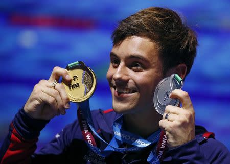 Diving – 17th FINA World Aquatics Championships – Men's 10m Platform awarding ceremony – Budapest, Hungary – July 22, 2017 – Tom Daley of Britain (gold) poses with the medals. REUTERS/Stefan Wermuth