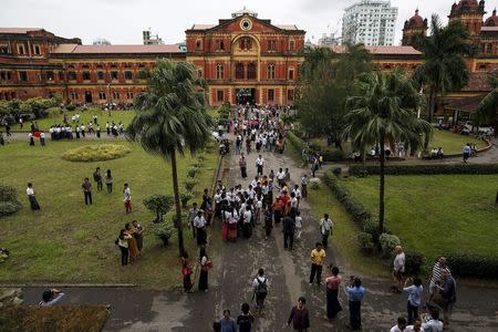 People visit the Ministers' Building, formerly known as the Secretariat Builidng, where General Aung San and eight others were assassinated, during an event marking the anniversary of Martyrs' Day in Yangon July 19, 2015. REUTERS/Soe Zeya Tun