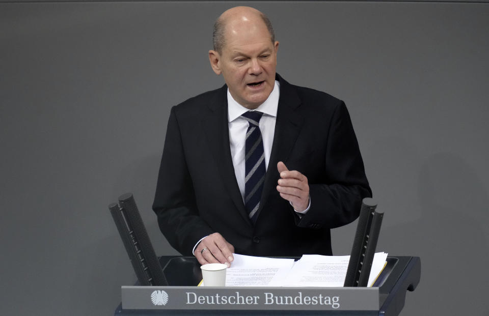 German Chancellor Olaf Scholz delivers a speech during a meeting of the German federal parliament, Bundestag, at the Reichstag building in Berlin, Germany, Wednesday, Dec. 15, 2021. (AP Photo/Michael Sohn)