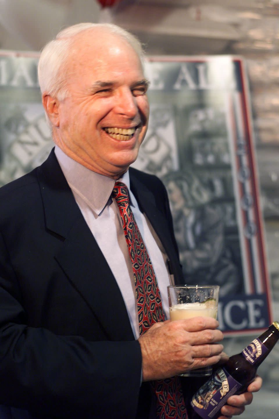 <p>McCain laughs after having a taste of Nutfield Brewery's Primary Pale Ale during a campaign visit to the Derry, New Hampshire brewery in September 1999. </p>