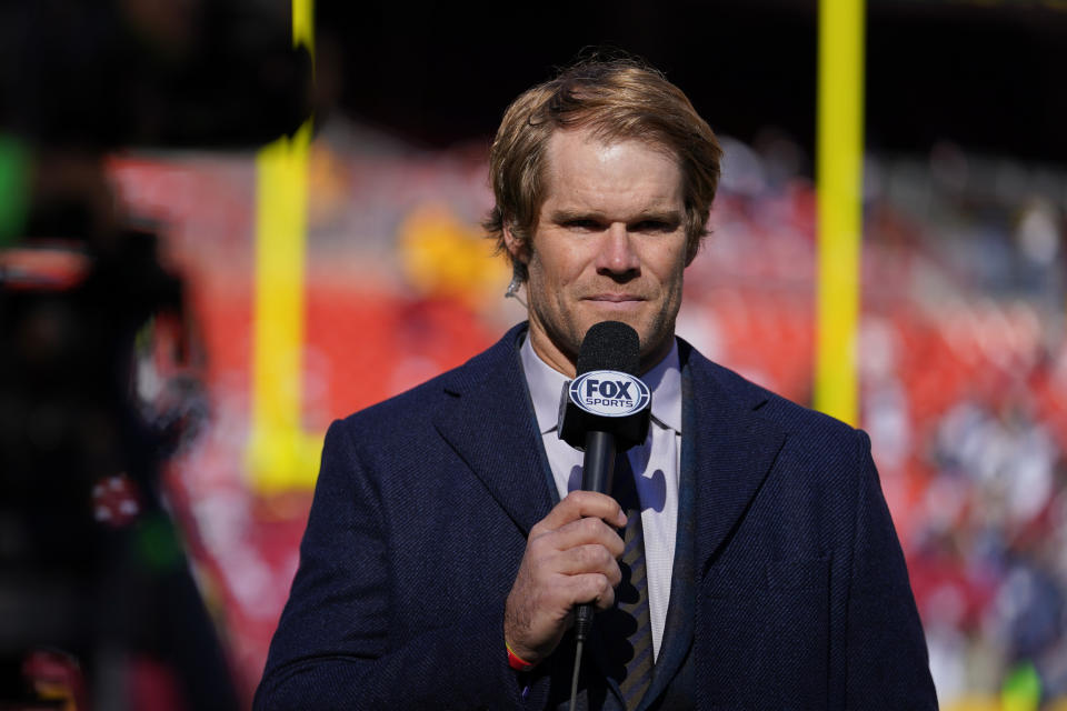 FILE -Former NFL tight end Greg Olsen gives a report during pregame warmups prior to the start of the first half of an NFL football game between the Washington Football Team and the Dallas Cowboys, Sunday, Dec. 12, 2021, in Landover, Md. The NFL's free agency, at least when it comes to its top announcing crews, is over for this year. Fox Sports completed its lineup for this season on Tuesday, May 31, 2022 by naming Greg Olsen as its NFL analyst.(AP Photo/Julio Cortez, File)