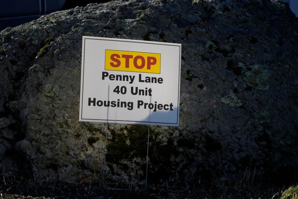 A lawn sign on Kenny Drive in Warren expresses opposition to the proposed Penny Lane affordable housing development.