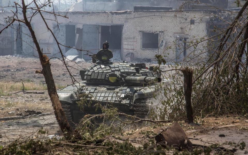 A Ukrainian tank is in position during heavy fighting on the front line in Severodonetsk - AP Photo/Oleksandr Ratushniak