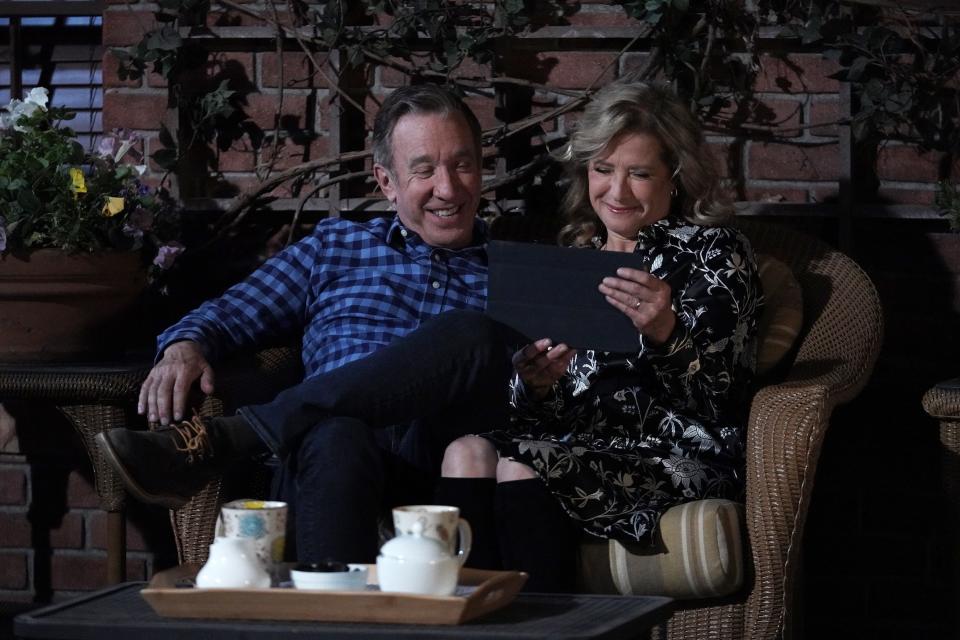 Mike (Tim Allen), left, and Vanessa (Nancy Travis) enjoy a happy moment talking to daughter Eve via tablet in the series finale of Fox's "Last Man Standing."