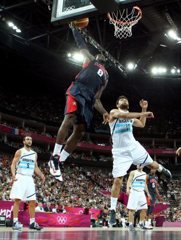LeBron James goes up for a dunk over Carlos Delfino during the Men's Basketball semifinal (Getty Images)