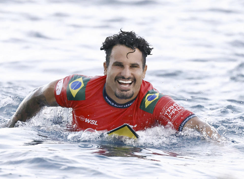 Surfer Italo Ferreira of Brazil celebrates after winning the latest competition of the World Surf League Championship Tour in Teahupoʻo in Tahiti on May 30, 2024. (Kyodo News via AP)