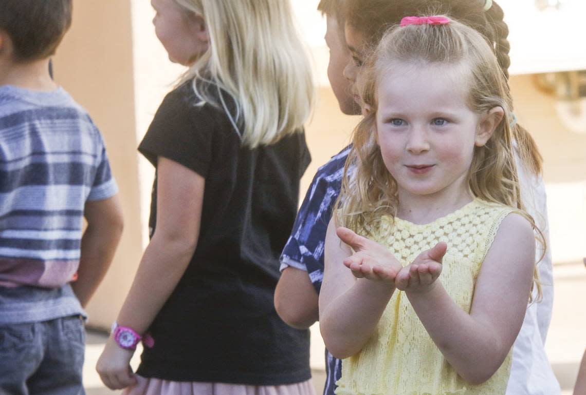 Shae Shoebridge, 4, blows kisses to her parents, Erin and Ian, before entering her kindergarten classroom at San Gabriel Elementary School in Atascadero in 2018.