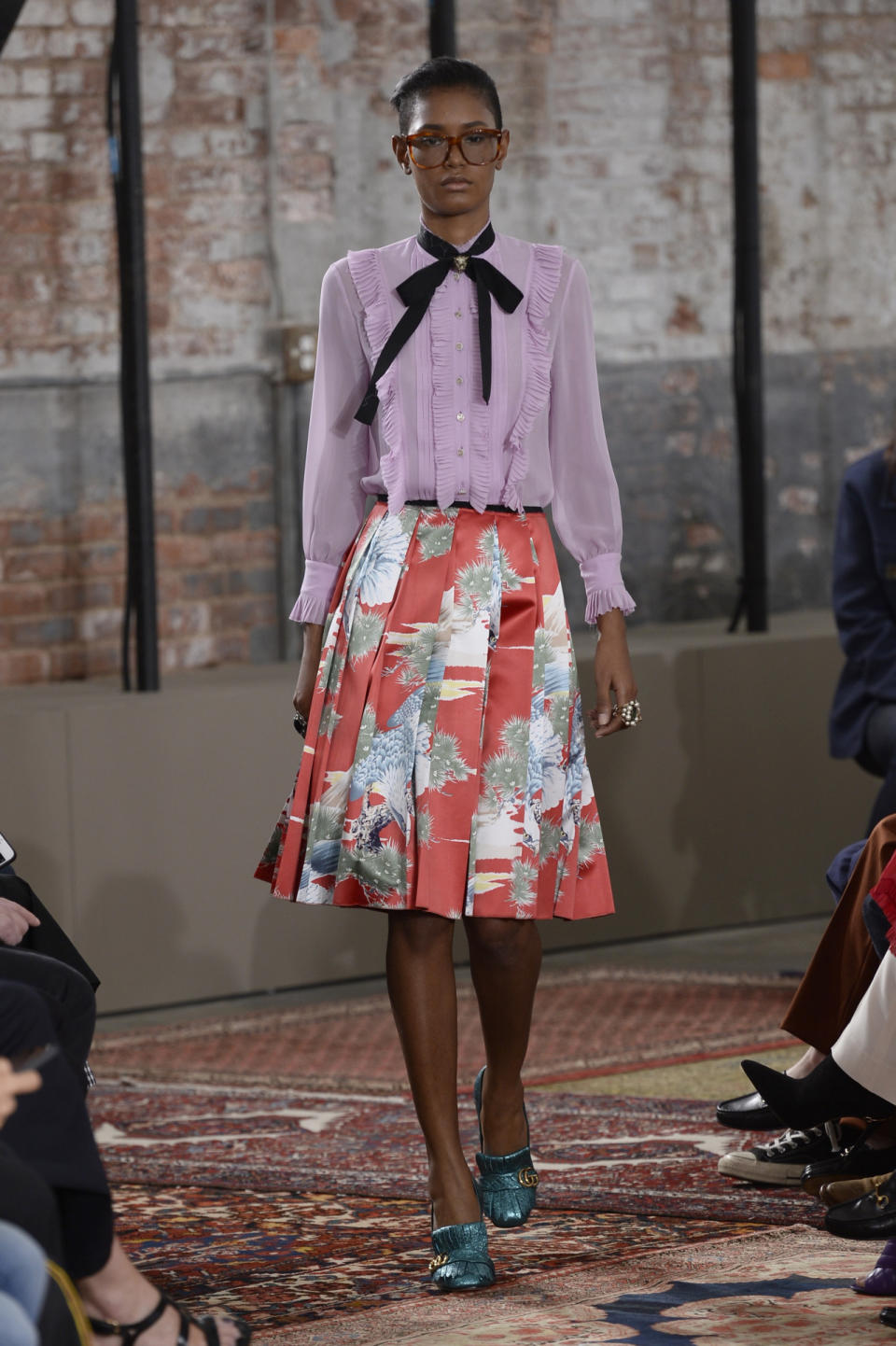 A purple blouse and full floral skirt from the Gucci Resort 2016 collection.