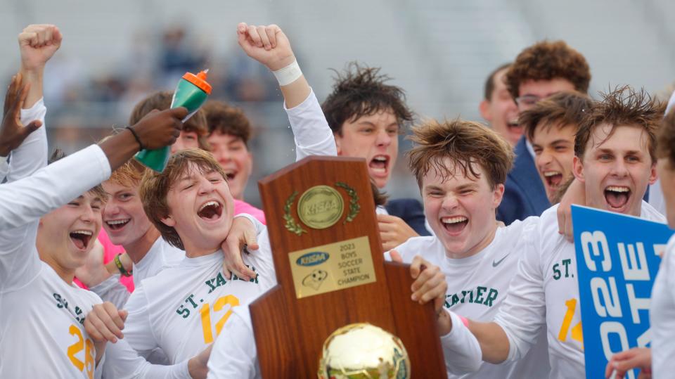 St. Xavier celebrates its victory in the state soccer championship game Saturday in Lexington.