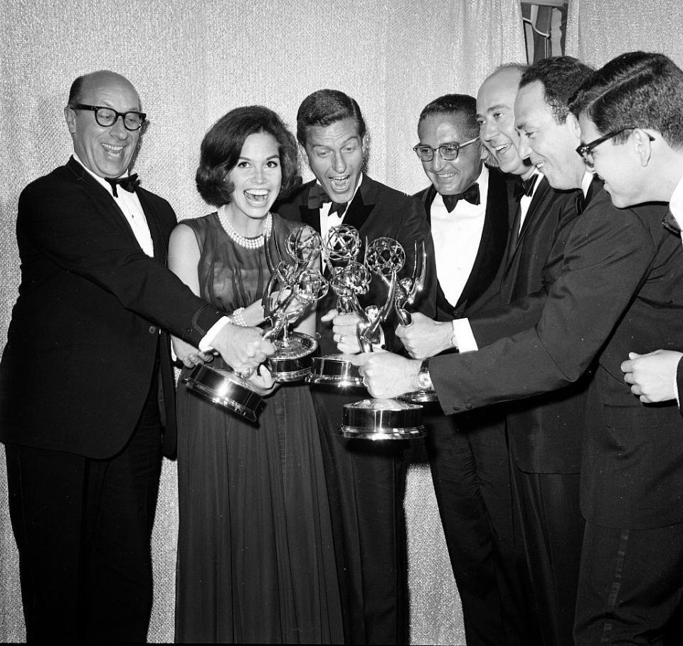 <p>The cast of <em>The Dick Van Dyke Show </em>celebrate their Emmy win. The hit series won 14 Emmys during its five season run, and launched a successful spin-off,<em> The Mary Tyler Moore Show.</em></p>