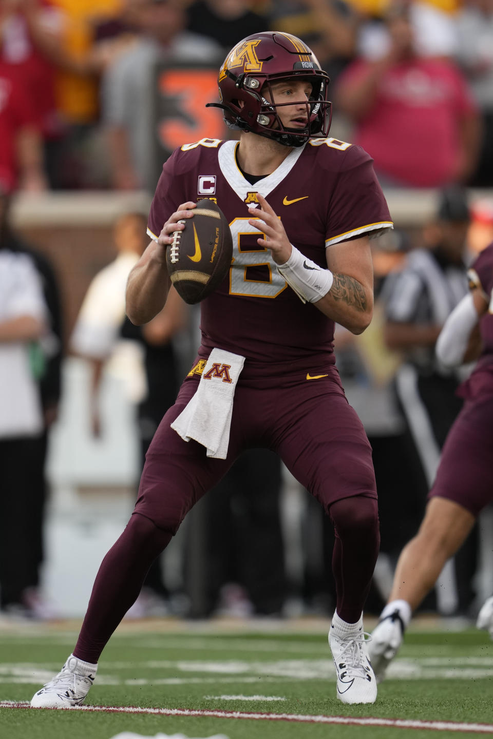 Minnesota quarterback Athan Kaliakmanis (8) looks to pass during the first half of the team's NCAA college football game against Nebraska, Thursday, Aug. 31, 2023, in Minneapolis. (AP Photo/Abbie Parr)