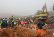 Rescue workers remove the rubble after a mudslide in the mountain town of Regent, Sierra Leone. REUTERS/Ernest Henry