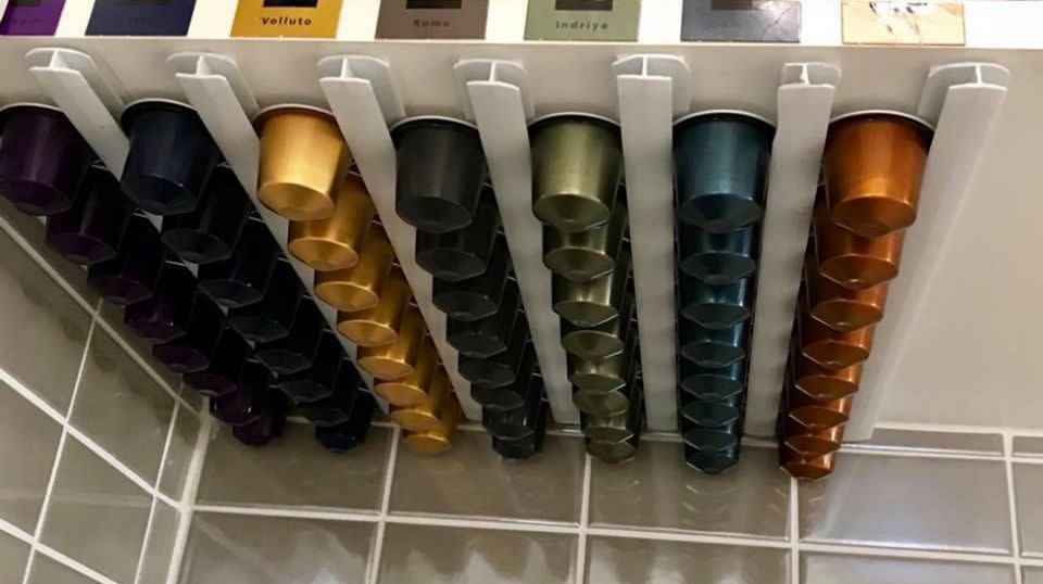 Using the PVC piping, she was able to slide her stacks of nespresso pods neatly into the slots. Source: Facebook / Gina Baynham