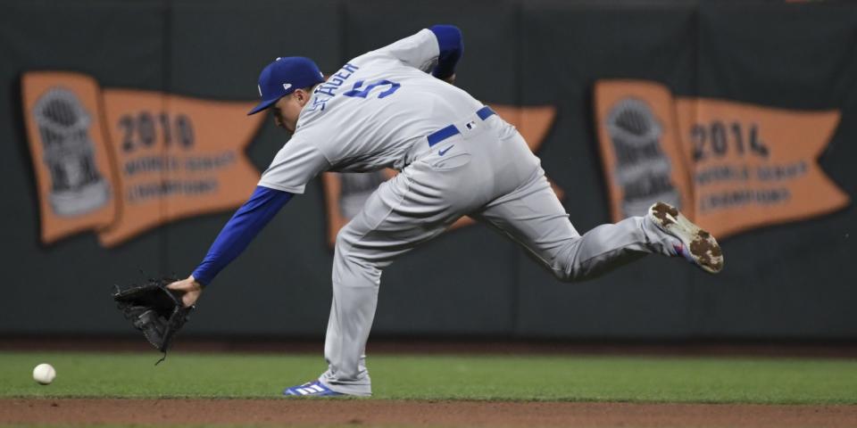 Dodgers shortstop Corey Seager goes after a single hit by San Francisco Giants' Brandon Crawford