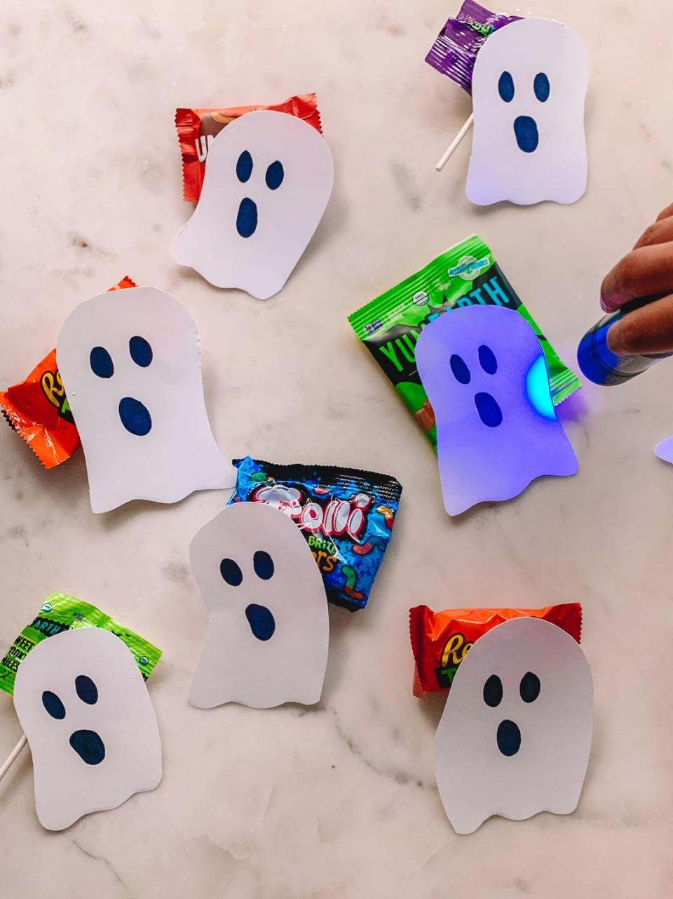 <p>No trick or treating this year? No problem. Use some white paper and a black light (or turn your phone into one) to create a super fun candy hunt. </p><p><em><a href="https://studiodiy.com/black-light-halloween-candy-hunt/" rel="nofollow noopener" target="_blank" data-ylk="slk:Get the tutorial at Studio DIY »;elm:context_link;itc:0;sec:content-canvas" class="link ">Get the tutorial at Studio DIY »</a></em> </p>