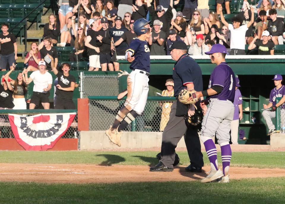 Scott Gintof celebrates scoring the game's first run in front of a fired up Essex student section during the Hornets 9-0 win over Brattleboro at Centennial field.