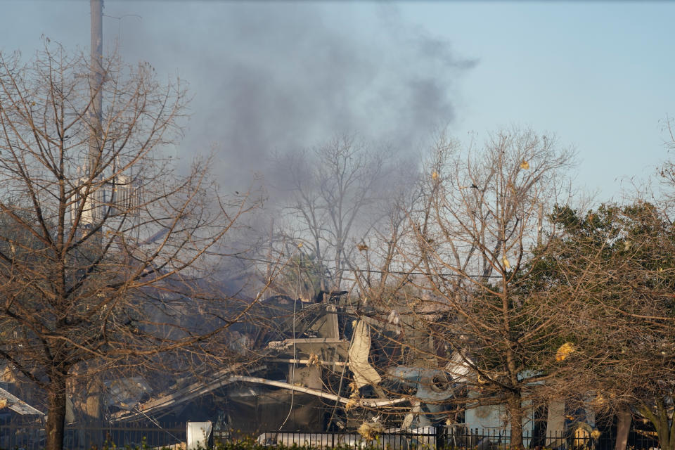 Smoke fills the sky after a massive explosion rocks west Houston Friday, Jan. 24, 2020, in Houston. A massive explosion early Friday leveled a warehouse in Houston and damaged nearby buildings and homes, rousing frightened people from their sleep miles away. (Melissa Phillips/Houston Chronicle via AP)