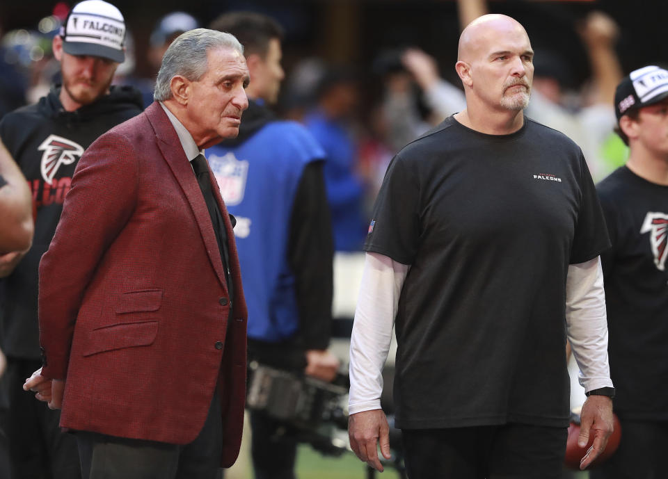 Atlanta Falcons owner Arthur Blank and head coach Dan Quinn watch the team prepare to play the Seattle Seahawks in an NFL football game on Sunday, Oct. 27, 2019, in Atlanta. (Curtis Compton/Atlanta Journal-Constitution via AP)