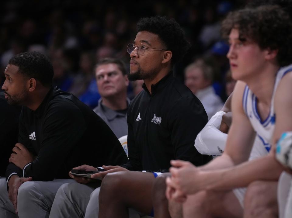 Drake University graduate assistant coach Ayo Akinwole looks on during Thursday's game against Valparaiso.