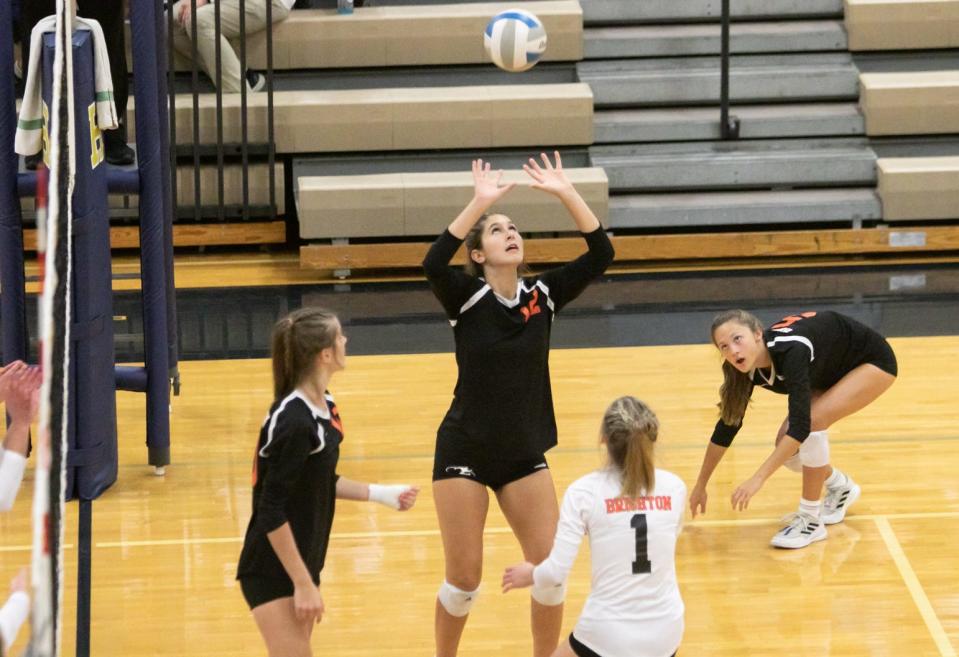 Brighton's Lea Gage sets the ball in the volleyball match at Hartland High School Thursday, Sept. 8, 2022.