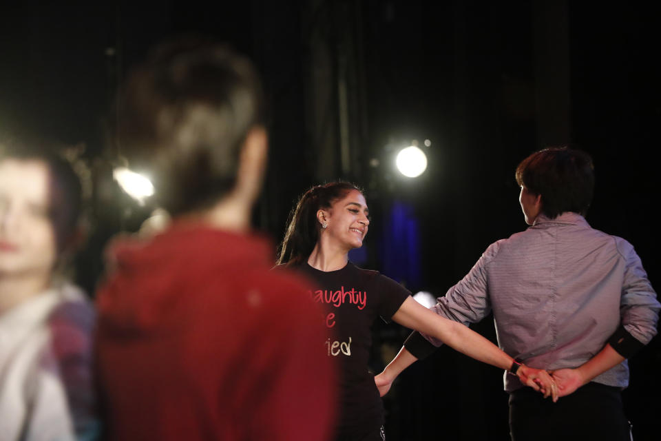 Dancer Lusian Hernandez, dances during a rehearsal of Vladimir Issaev's rendition of The Nutcracker ballet on Friday, Dec. 13, 2019, in Fort Lauderdale, Fla. More than 20 dancers of Venezuelan origin were playing various roles on a recent performance of the holiday favorite “The Nutcracker.” Some of these dancers are here seeking asylum after fleeing their crisis-torn nation, which is plagued by shortages of food and medicine. (AP Photo/Brynn Anderson)