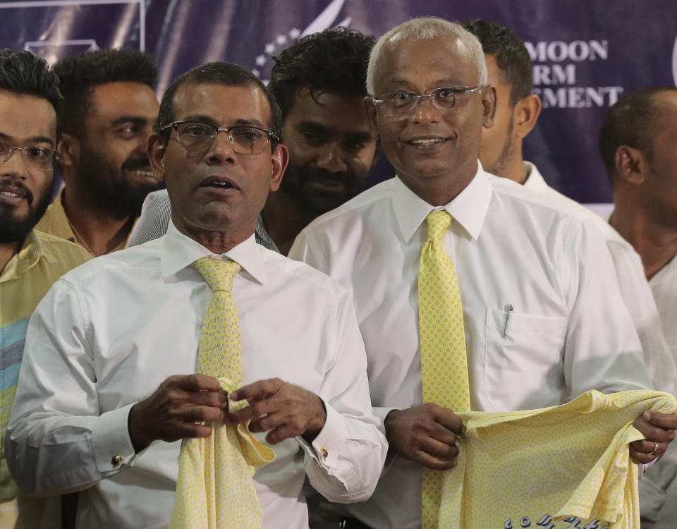 Former Maldivian President Mohamed Nasheed, left, and opposition presidential candidate Ibrahim Mohamed Solih, right, attend a meeting with Maldivian community living in Sri Lanka, in Colombo, Sri Lanka, Monday, Aug. 27, 2018. Maldives' opposition presidential candidate has expressed fears that the next month's presidential election would not be free and fair, accusing that the government may rig the election.(AP Photo/Eranga Jayawardena)