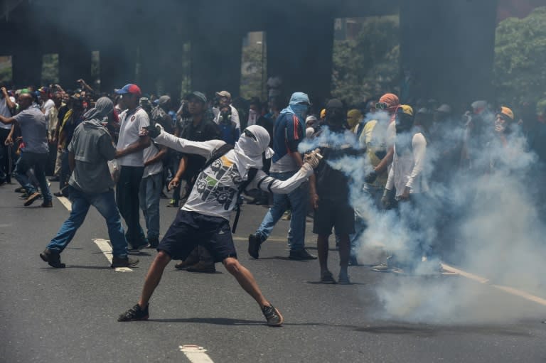 Marchers in Caracas were forced back by lines of soldiers and police deployed to contain what the opposition vowed would be the "mother of all protests"