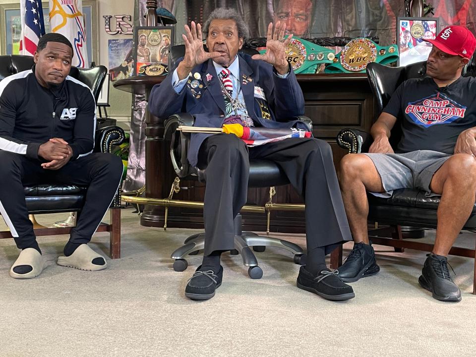 Boxing promoter Don King (center) discusses his upcoming card at his Deerfield Beach office while flanked by Adrien Broner (left), who headlines the card and trainer Kevin Cunningham.