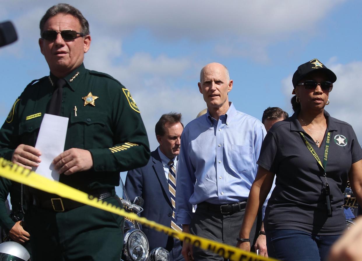 Florida Governor Rick Scott,(R), and Broward County Sheriff, Scott Israel (L), walk up to the media to speak about the mass shooting: Mark Wilson/Getty Images