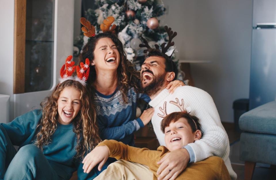 family laughing together on christmas