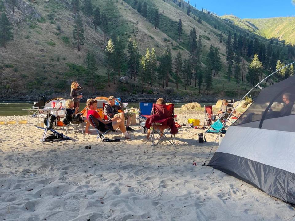 Members of Paul Beckford’s rafting group sit at the Spring Bar boat ramp on the Main Salmon River on July 4. The group paid Wild River Shuttle to drop off five vehicles, but only one was delivered. They camped at the boat ramp for a night.