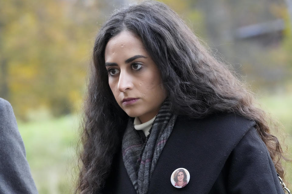 Lina Abu Akleh, niece of fatally shot Al Jazeera journalist Shireen Abu Akleh, waits outside the International Criminal Court in The Hague, Netherlands, Tuesday, Dec. 6, 2022, after Al Jazeera presented a letter requesting a formal investigation into the killing. Palestinian officials, Abu Akleh's family and Al Jazeera accuse Israel of intentionally targeting and killing the 51-year-old journalist, a claim Israel denies. (AP Photo/Peter Dejong)