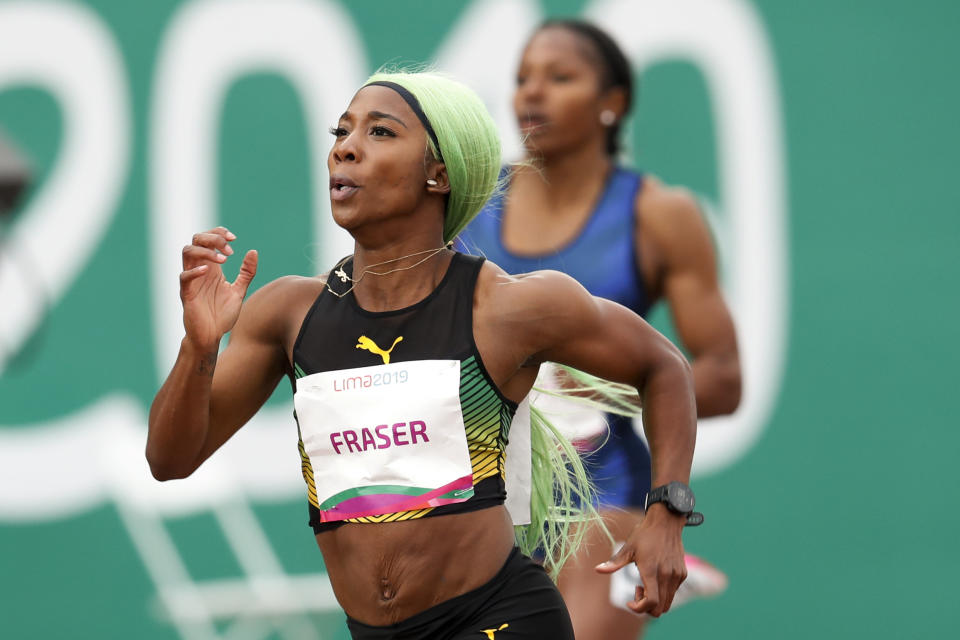 Shelly-Ann Fraser-Pryce of Jamaica runs to win the gold medal in the women's 200m final during the athletics at the Pan American Games in Lima, Peru, Friday, Aug. 9, 2019. (AP Photo/Moises Castillo)
