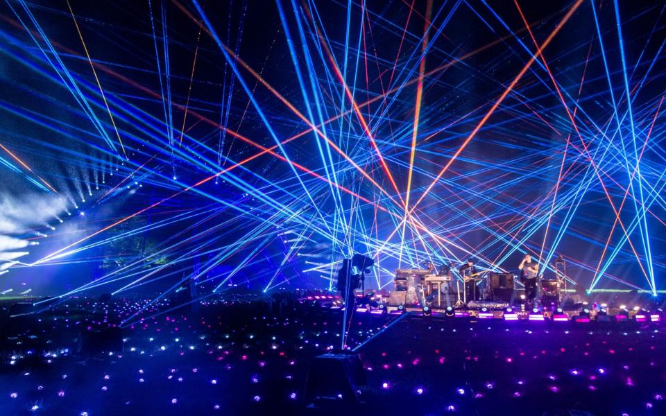 Coldplay performs in front of the main Pyramid Stage as part of the Glastonbury Festival Global Livestream, "Live at Worthy Farm" - Anna Barclay/Glastonbury Festival/Getty Images